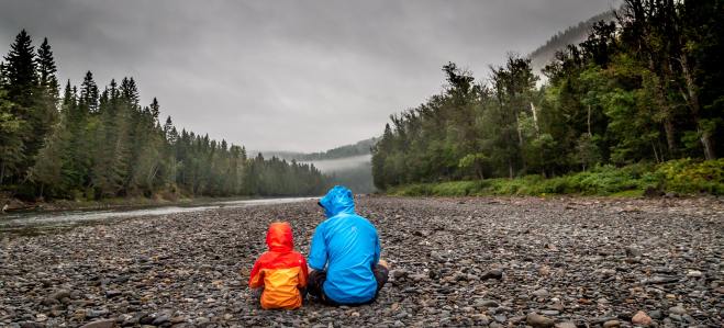 Father talking under the rain