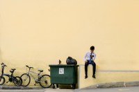 Young man in business wear against a beige background